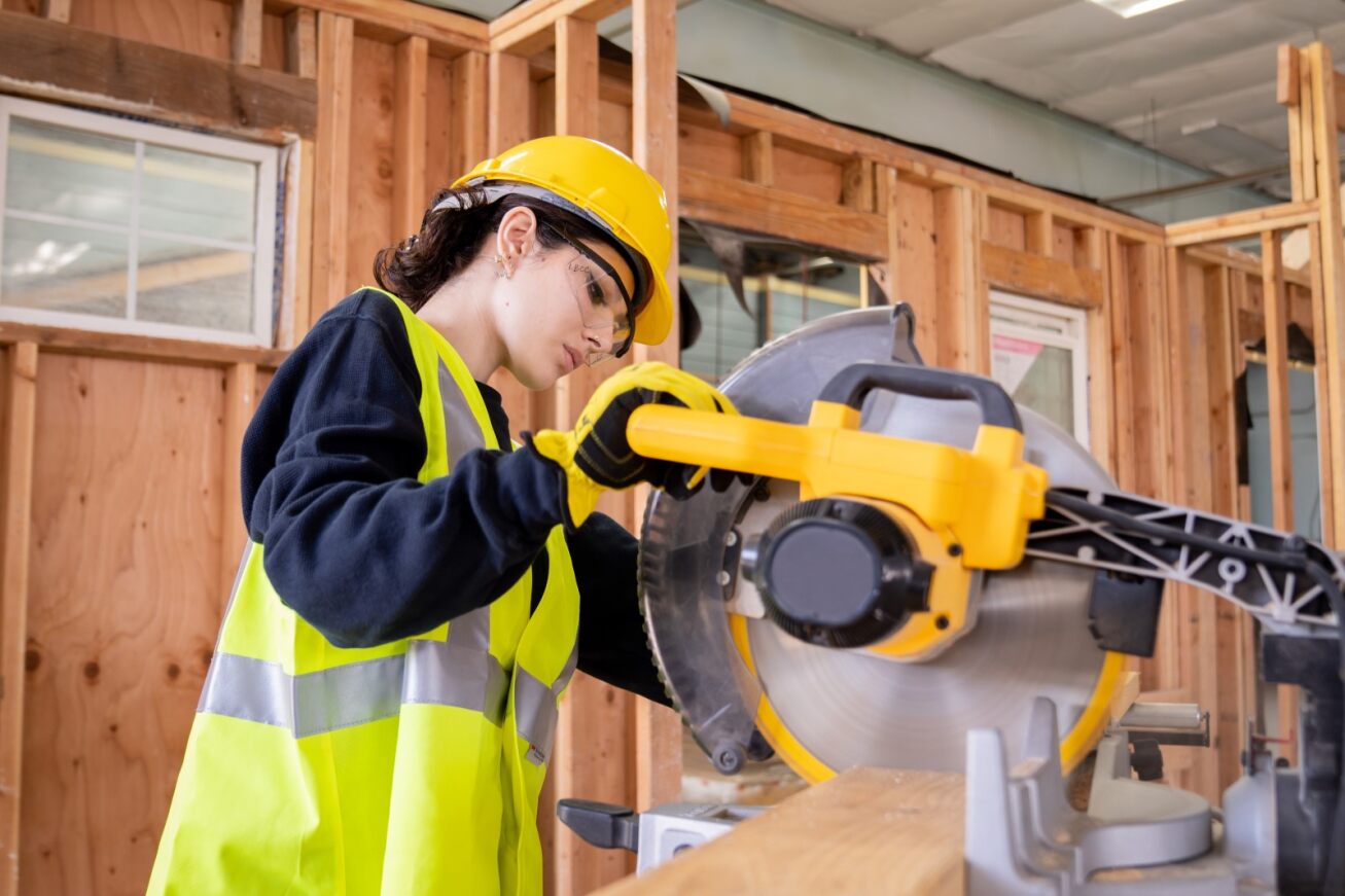 A student operates a saw