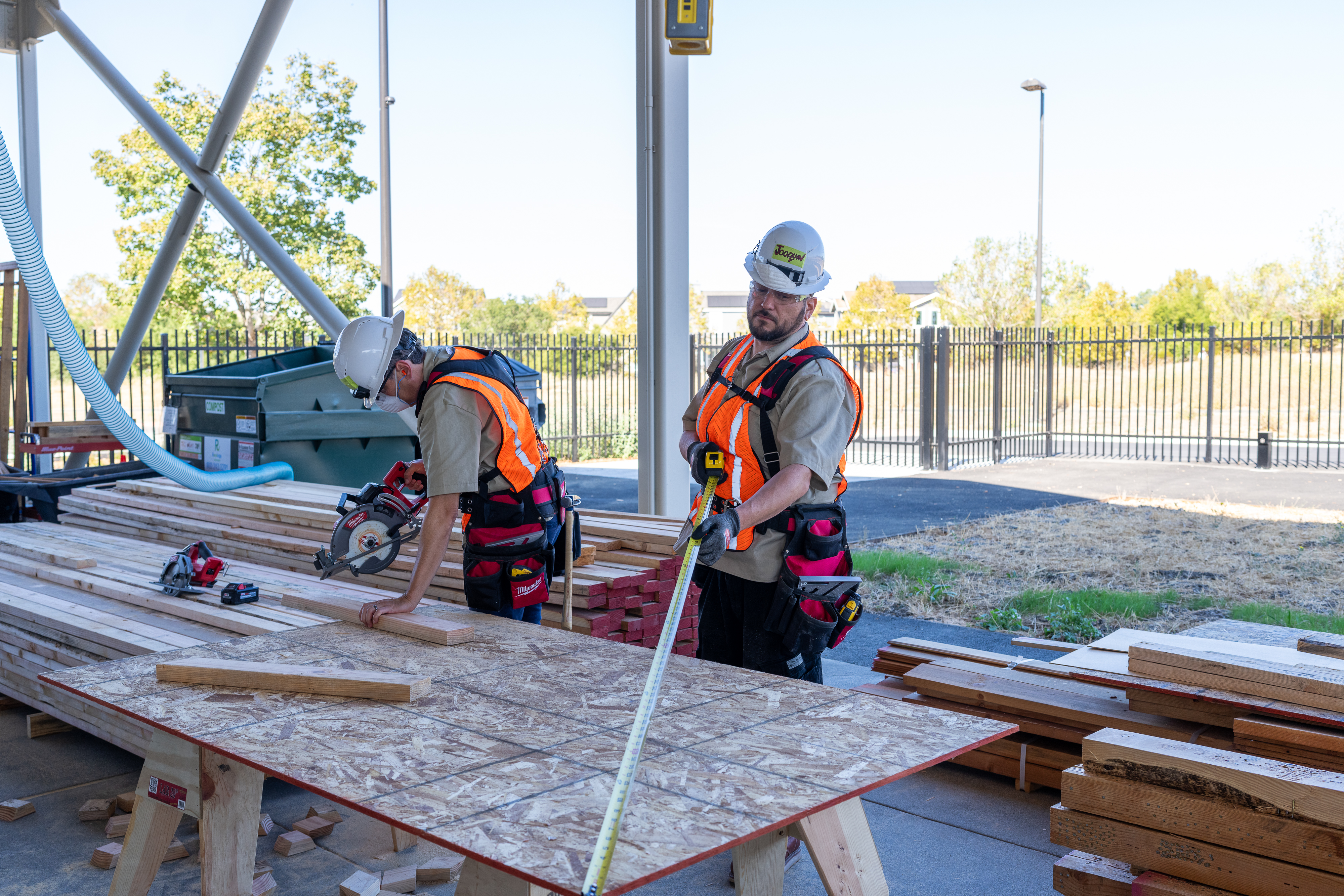 Students measuring, cutting