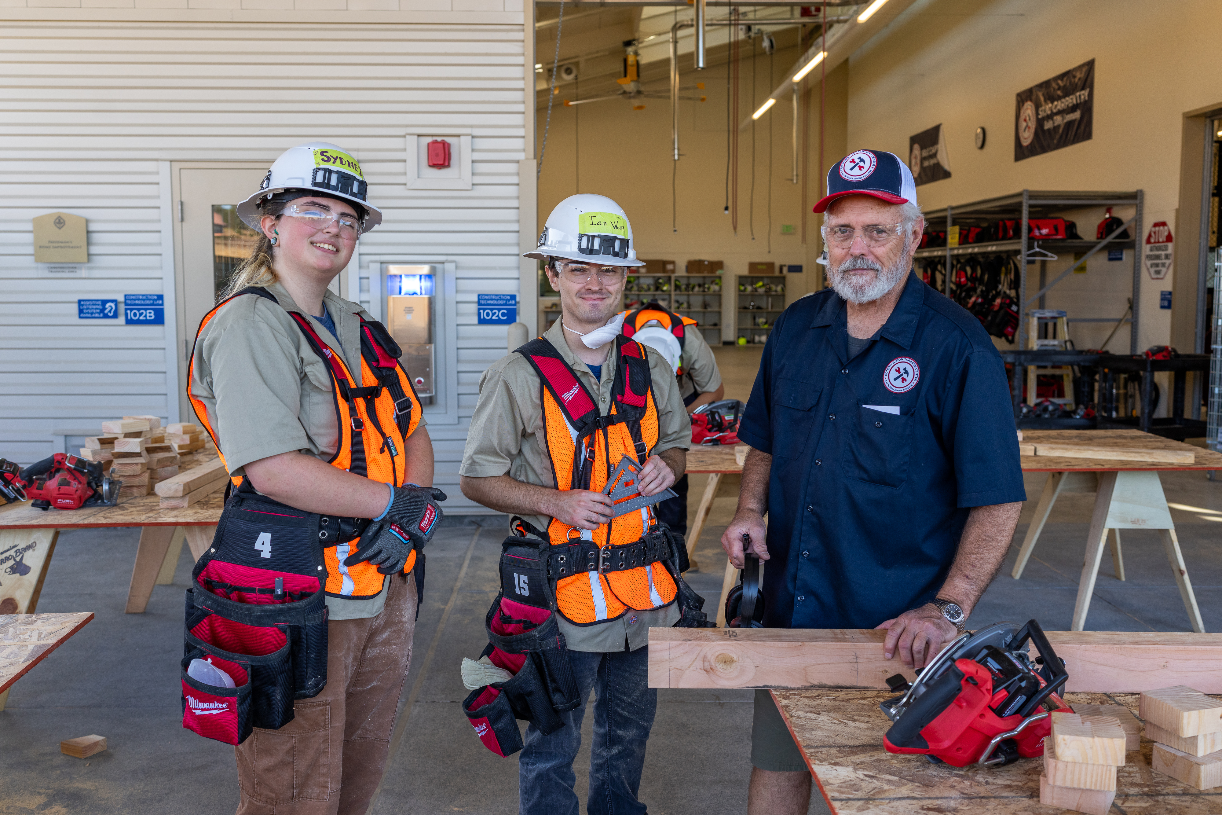 Carpentry students and instructor pose for a photo