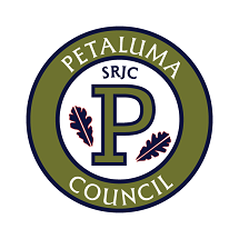 Petaluma Council logo picturing a green circle with white text reading 'PETALUMA COUNCIL" and in the center of the circle is a green capital letter "P" with "SRJC" written above and two leaves on either side