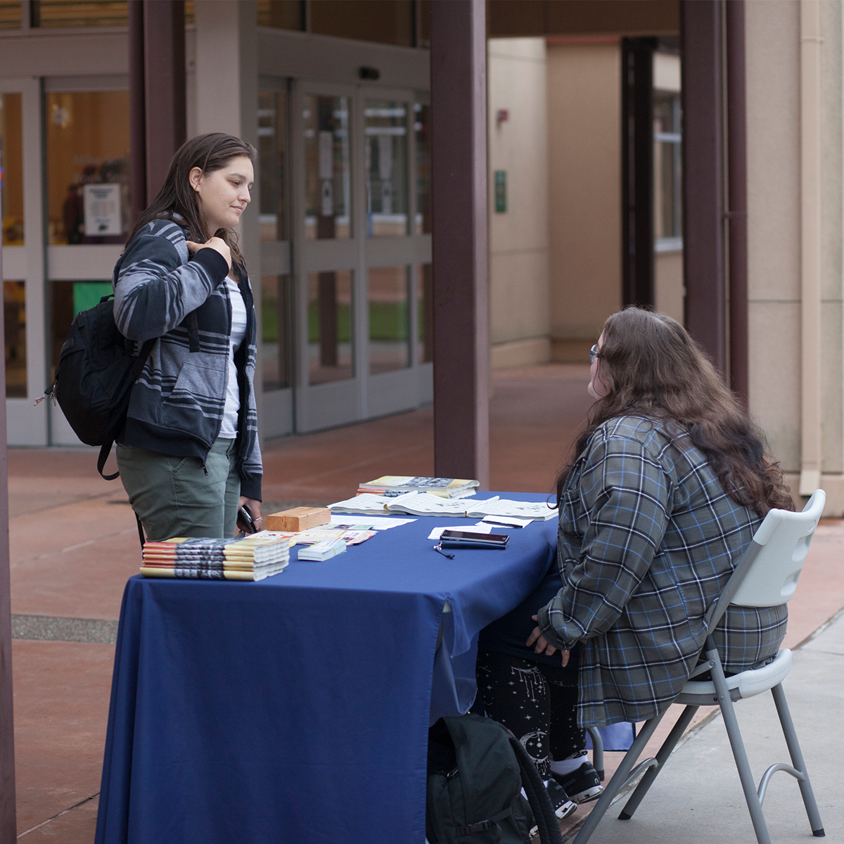 Two students talking in Rotary Plaza on the Petaluma Campus