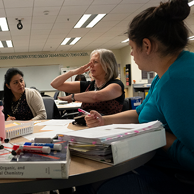 Students at a table studying